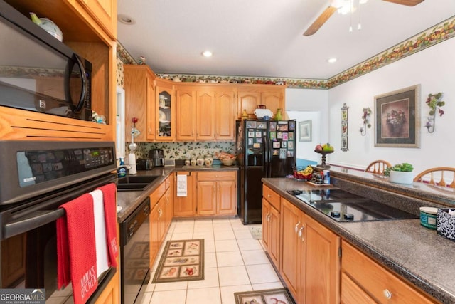 kitchen with black appliances, dark countertops, light tile patterned floors, a ceiling fan, and glass insert cabinets