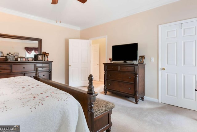 bedroom with carpet flooring, crown molding, a ceiling fan, and baseboards