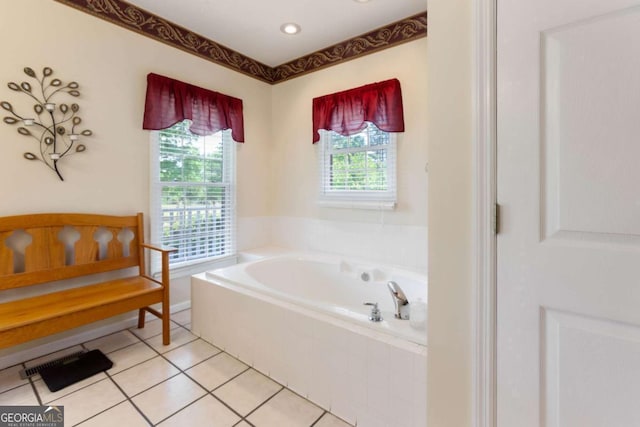 bathroom featuring a bath and tile patterned flooring