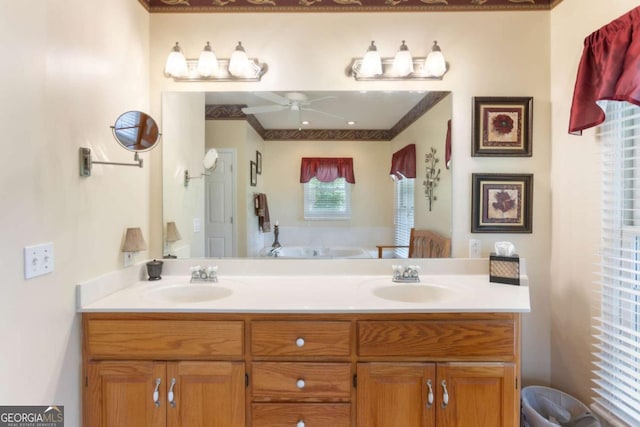 bathroom with a ceiling fan, double vanity, and a bath