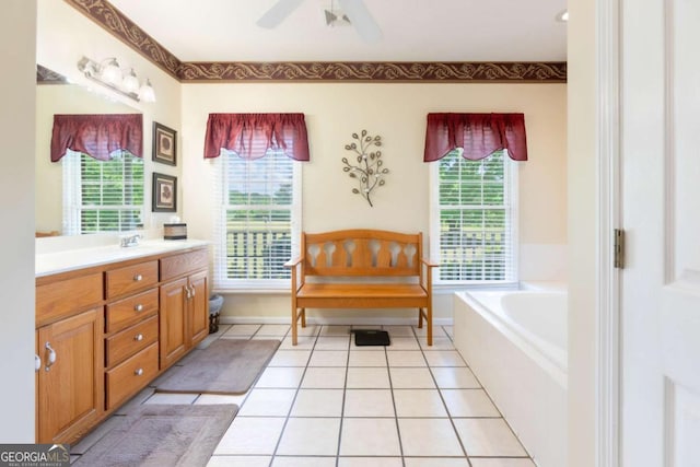 full bathroom featuring vanity, a garden tub, tile patterned flooring, and ceiling fan