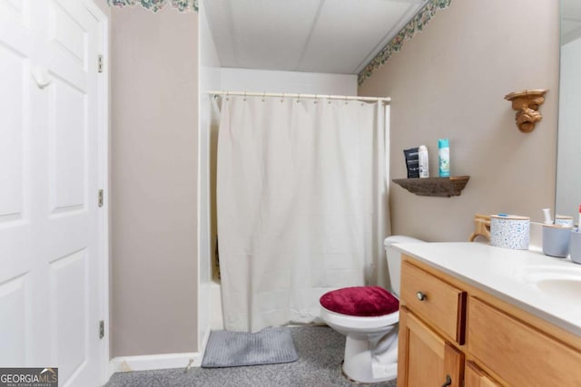 bathroom featuring toilet, vanity, and shower / bath combo