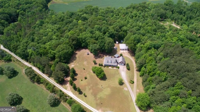 aerial overview of property's location featuring a heavily wooded area