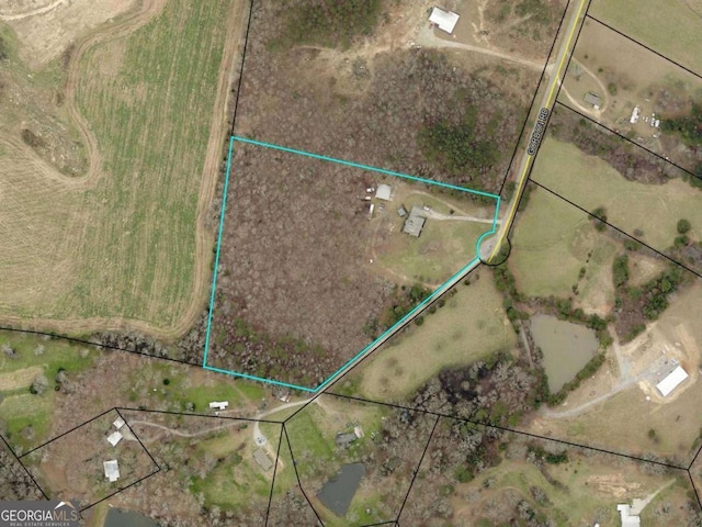 aerial view of property's location featuring property parcel outlined