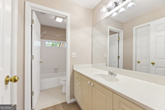 full bath featuring toilet, vanity, shower / washtub combination, and tile patterned flooring