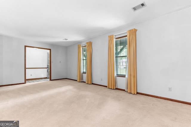 182 Quail Hollow Ln, Fort Valley, GA 31030 - spare room featuring light carpet and baseboards