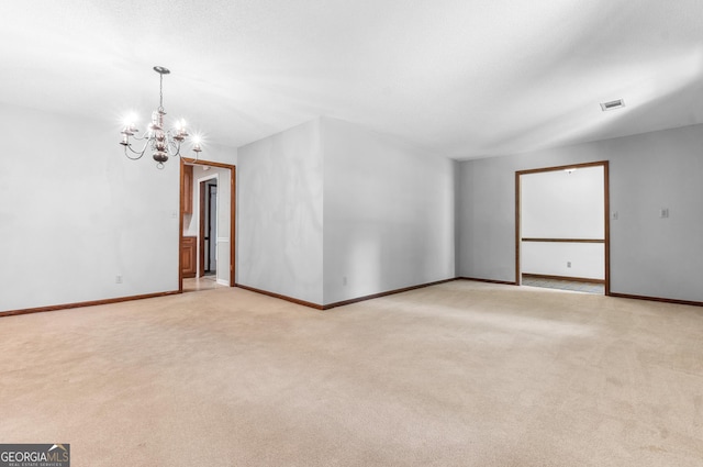 182 Quail Hollow Ln, Fort Valley, GA 31030 - empty room with a chandelier, light colored carpet, and baseboards