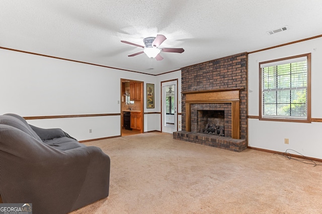 182 Quail Hollow Ln, Fort Valley, GA 31030 - living room with ornamental molding, a ceiling fan, carpet floors, a fireplace, and baseboards