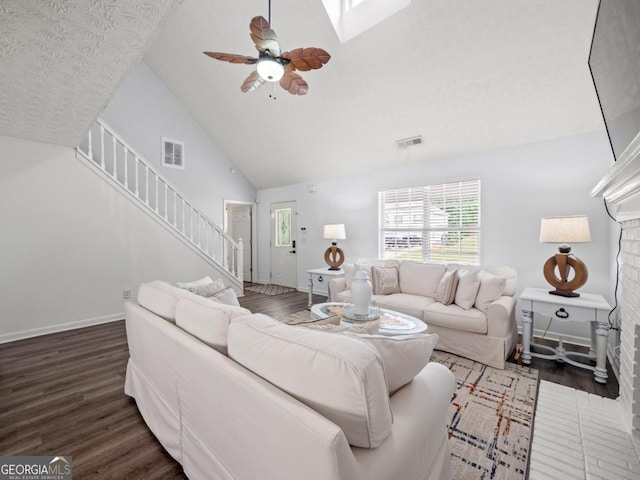5293 Hopewell Ln, Gainesville, GA 30507 - living room featuring wood finished floors, stairs, ceiling fan, high vaulted ceiling, and baseboards