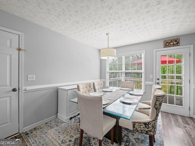 5293 Hopewell Ln, Gainesville, GA 30507 - dining space featuring a textured ceiling and wood finished floors