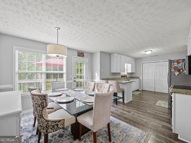 5293 Hopewell Ln, Gainesville, GA 30507 - dining room with dark wood-style floors, a textured ceiling, and baseboards