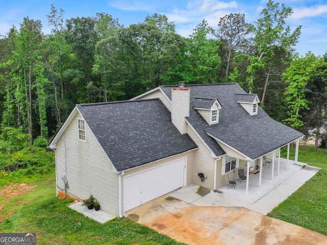 5293 Hopewell Ln, Gainesville, GA 30507 - view of front of property with concrete driveway, a garage, a front lawn, roof with shingles, and a chimney