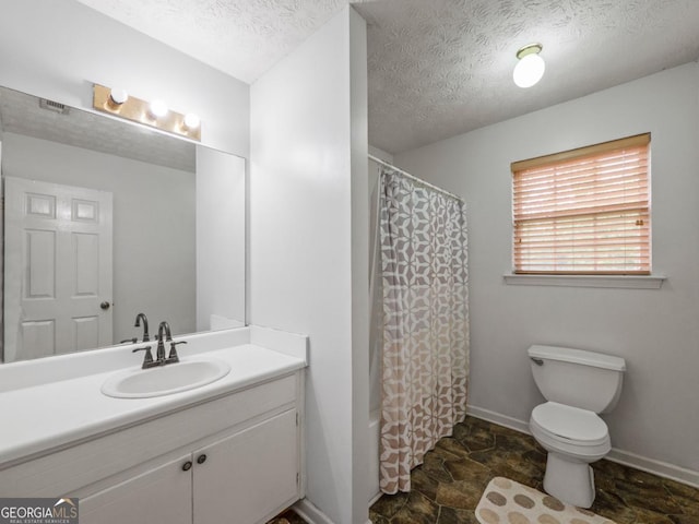 5293 Hopewell Ln, Gainesville, GA 30507 - full bathroom featuring stone finish flooring, toilet, a textured ceiling, vanity, and baseboards