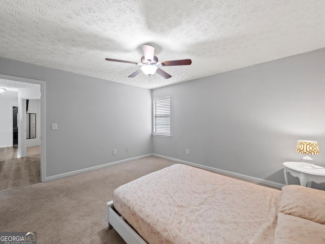 5293 Hopewell Ln, Gainesville, GA 30507 - carpeted bedroom with baseboards, ceiling fan, and a textured ceiling