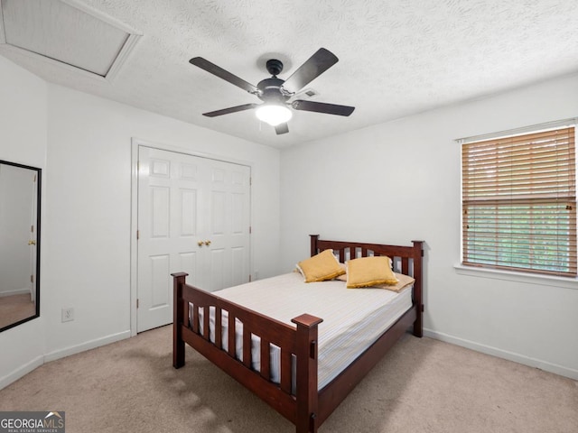 5293 Hopewell Ln, Gainesville, GA 30507 - bedroom featuring light colored carpet, baseboards, a textured ceiling, a ceiling fan, and a closet