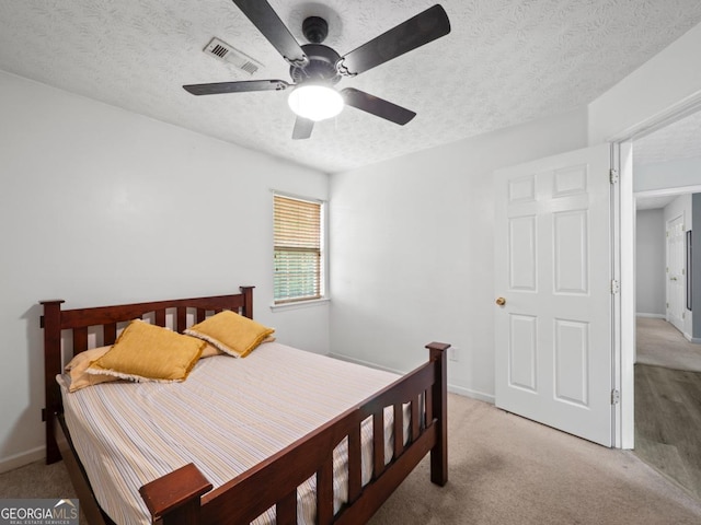 5293 Hopewell Ln, Gainesville, GA 30507 - bedroom with a textured ceiling, light colored carpet, baseboards, and a ceiling fan