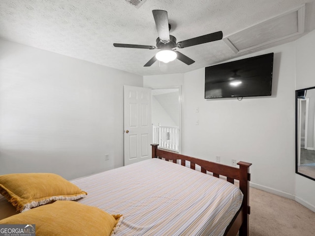 5293 Hopewell Ln, Gainesville, GA 30507 - bedroom with light colored carpet, baseboards, ceiling fan, a textured ceiling, and attic access