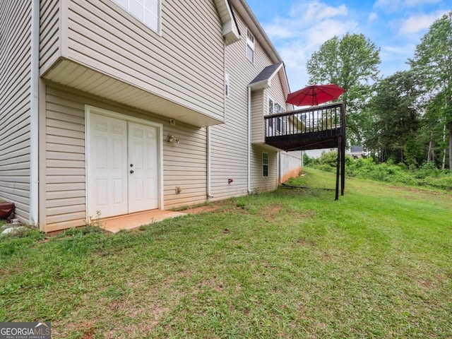 5293 Hopewell Ln, Gainesville, GA 30507 - view of exterior entry featuring a yard and a wooden deck