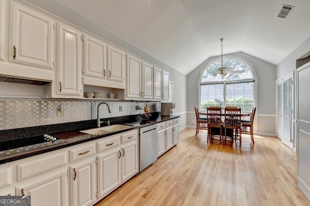 kitchen with a sink, stainless steel dishwasher, lofted ceiling, black electric stovetop, and light wood-type flooring