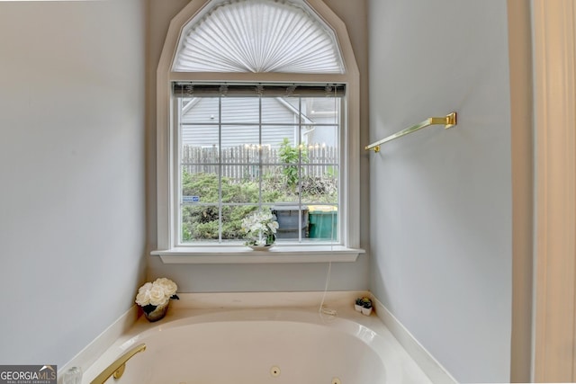 full bath featuring a jetted tub