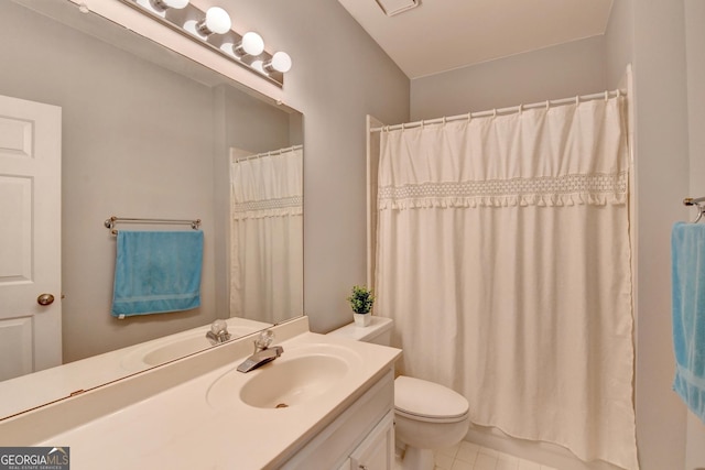 bathroom with vanity, toilet, tile patterned floors, and a shower with curtain