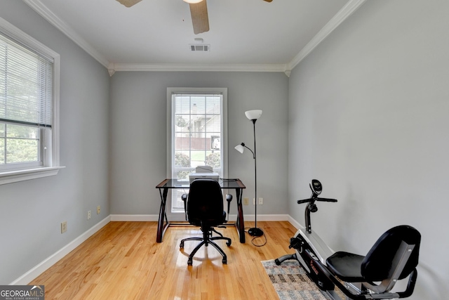 office area featuring wood finished floors, a ceiling fan, crown molding, and baseboards