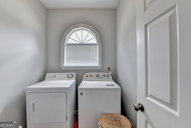 laundry room featuring separate washer and dryer