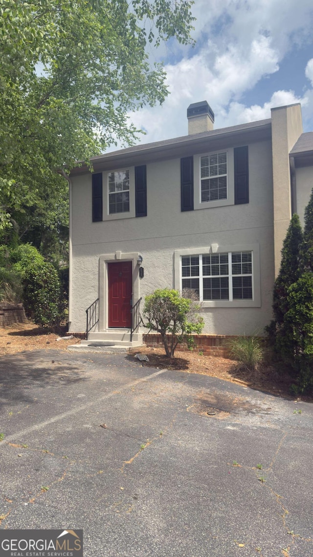 138 Tamara Ct, Athens, GA 30606 - colonial-style house featuring stucco siding and a chimney