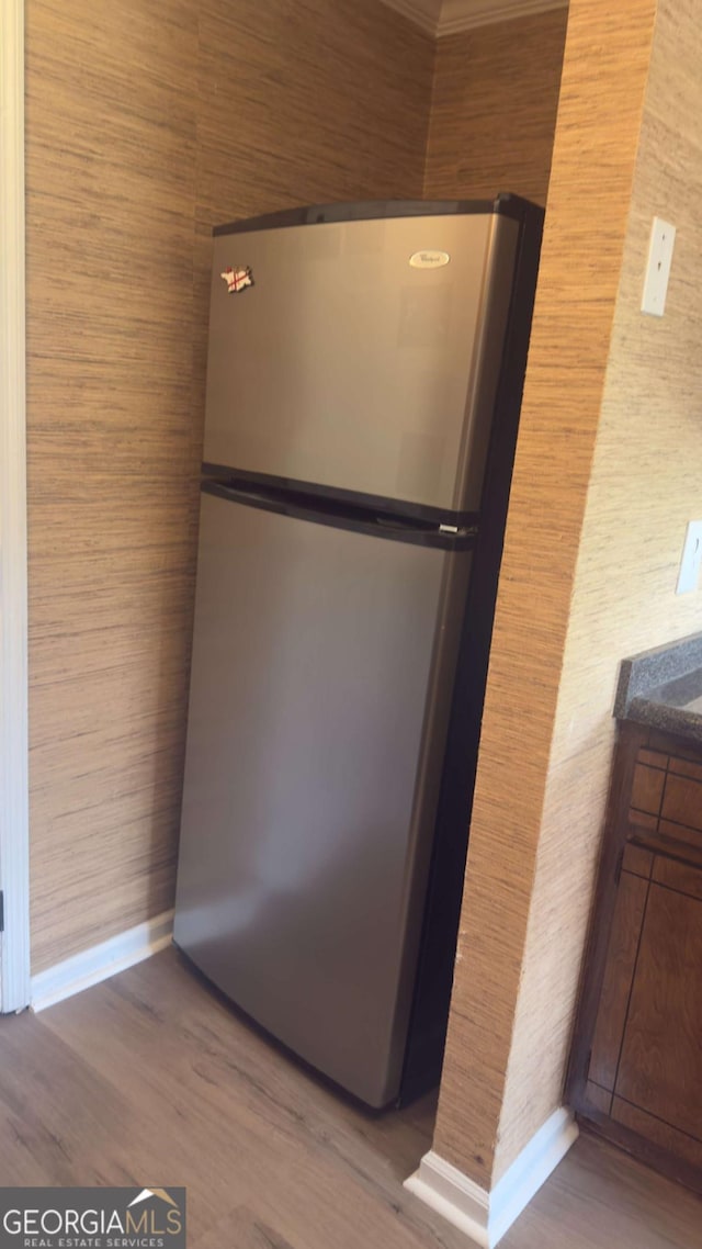 138 Tamara Ct, Athens, GA 30606 - kitchen view of freestanding refrigerator, baseboards, and wood finished floors
