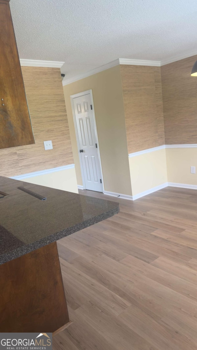 138 Tamara Ct, Athens, GA 30606 - spare room with wood finished floors, a textured ceiling, crown molding, and baseboards