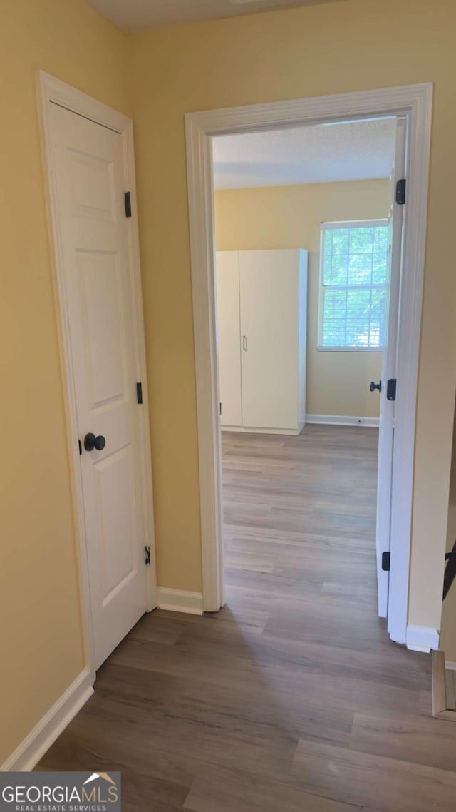 138 Tamara Ct, Athens, GA 30606 - hall featuring wood finished floors and baseboards
