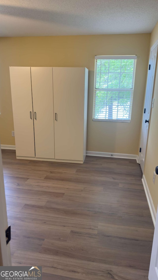 138 Tamara Ct, Athens, GA 30606 - unfurnished bedroom with wood finished floors and baseboards
