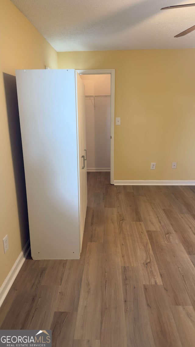 138 Tamara Ct, Athens, GA 30606 - spare room featuring wood finished floors, a ceiling fan, and baseboards