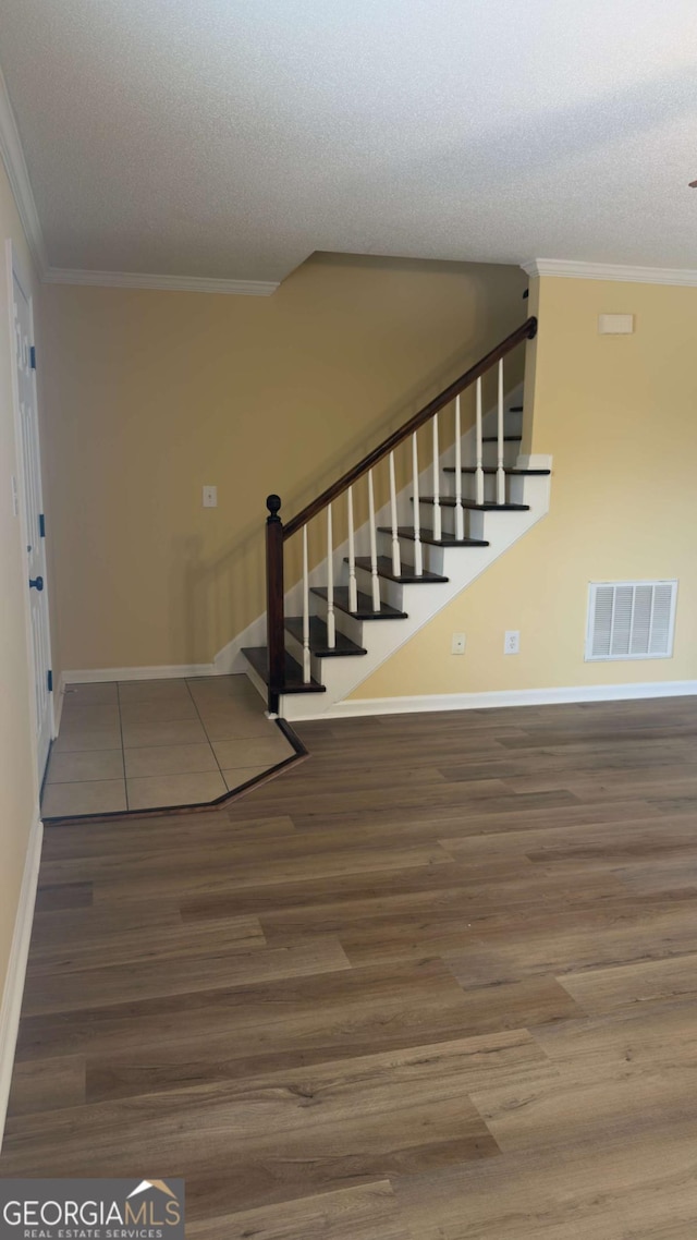 138 Tamara Ct, Athens, GA 30606 - stairs with ornamental molding, baseboards, wood finished floors, and a textured ceiling