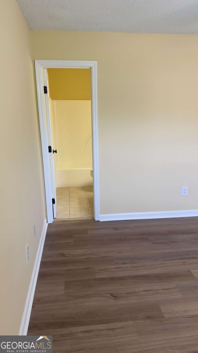 138 Tamara Ct, Athens, GA 30606 - spare room featuring baseboards, wood finished floors, and a textured ceiling