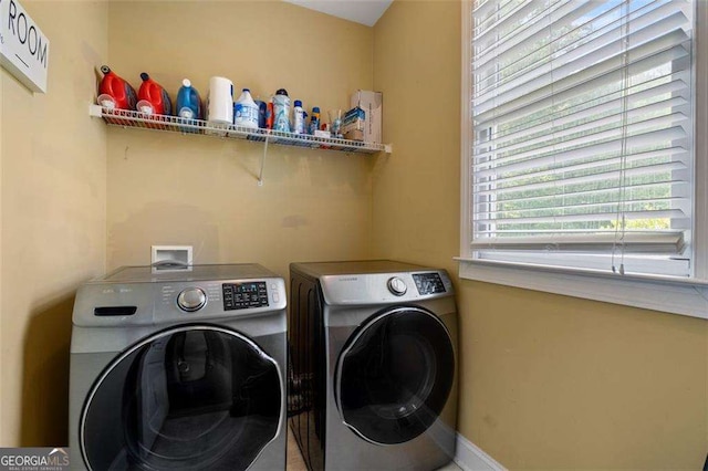 3705 Rolling Creek Dr, Buford, GA 30519 - laundry room with washer and clothes dryer and baseboards