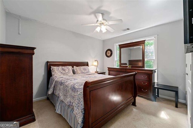 3705 Rolling Creek Dr, Buford, GA 30519 - bedroom featuring light colored carpet, baseboards, and ceiling fan