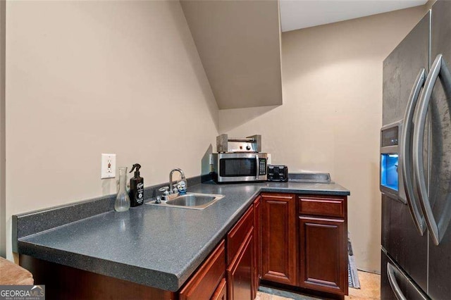 3705 Rolling Creek Dr, Buford, GA 30519 - kitchen featuring appliances with stainless steel finishes, a sink, dark countertops, and reddish brown cabinets