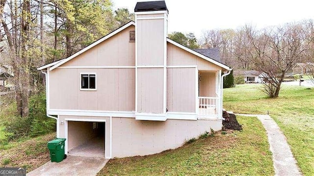 6092 Leverett Dr, Lithonia, GA 30038 - view of home's exterior featuring a garage and a lawn