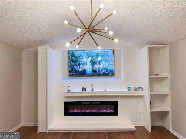 6092 Leverett Dr, Lithonia, GA 30038 - detailed view of a textured ceiling, wood finished floors, a chandelier, a glass covered fireplace, and baseboards