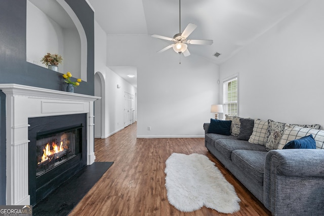 6045 Park Close, Fairburn, GA 30213 - living room with ceiling fan, wood finished floors, a fireplace with flush hearth, high vaulted ceiling, and baseboards