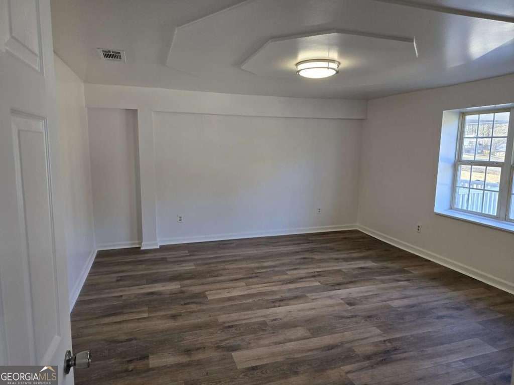 507 Jefferson Hwy, Winder, GA 30680 - spare room with dark wood finished floors and baseboards