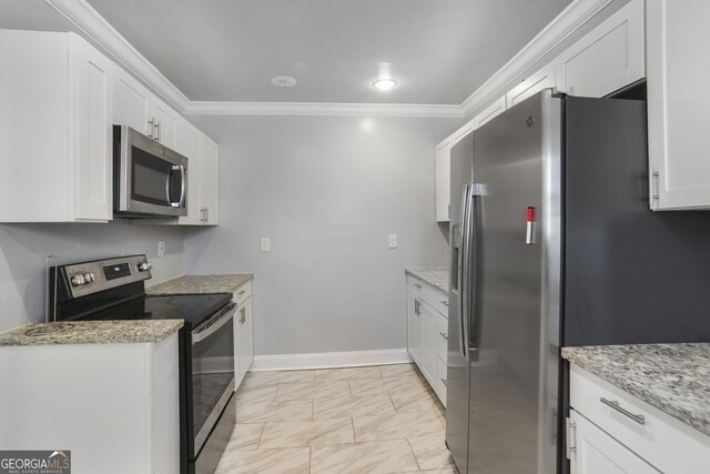 1560 Sarah M Harden Dr, Atlanta, GA 30311 - kitchen featuring appliances with stainless steel finishes, ornamental molding, light marble finish flooring, white cabinetry, and light stone countertops