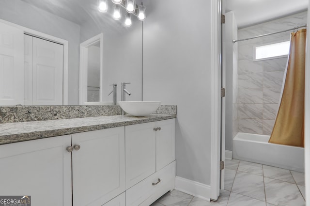 1560 Sarah M Harden Dr, Atlanta, GA 30311 - full bathroom with marble look tile flooring, baseboards, vanity, and shower / bathtub combination with curtain