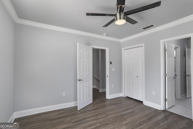 1560 Sarah M Harden Dr, Atlanta, GA 30311 - unfurnished bedroom with ornamental molding, baseboards, dark wood-style flooring, a closet, and a ceiling fan