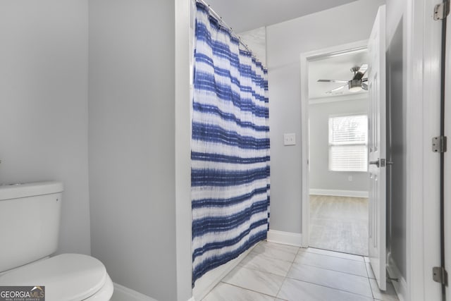 1560 Sarah M Harden Dr, Atlanta, GA 30311 - bathroom with toilet, a ceiling fan, a shower with shower curtain, and baseboards