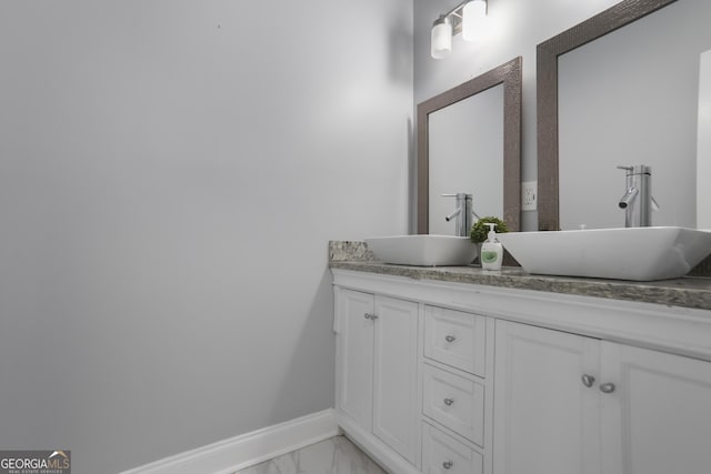1560 Sarah M Harden Dr, Atlanta, GA 30311 - full bath featuring marble look tiles, baseboards, and double vanity