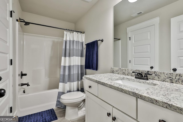full bath with toilet, vanity, and shower / bath combo