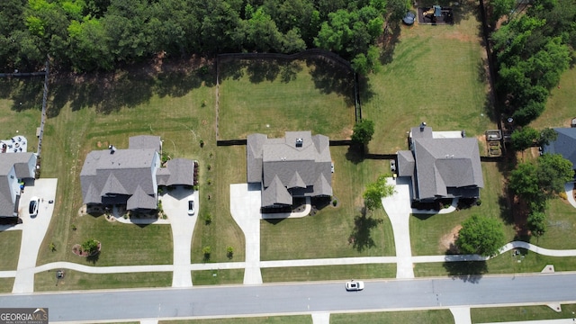 aerial overview of property's location with nearby suburban area