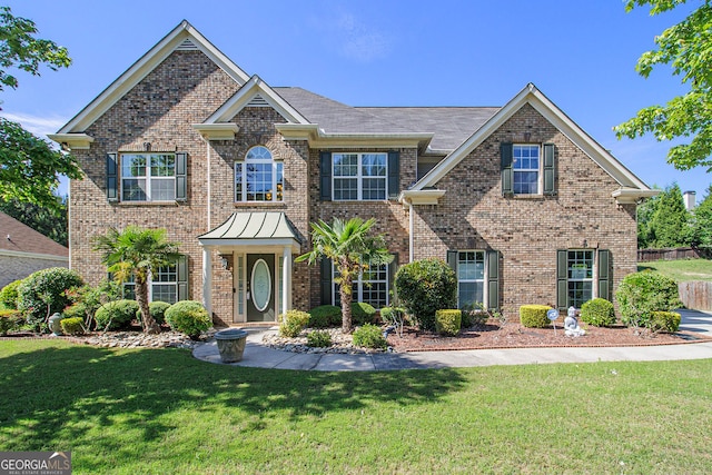 4765 Smokestone Dr, Douglasville, GA 30135 - colonial home with a front yard and brick siding